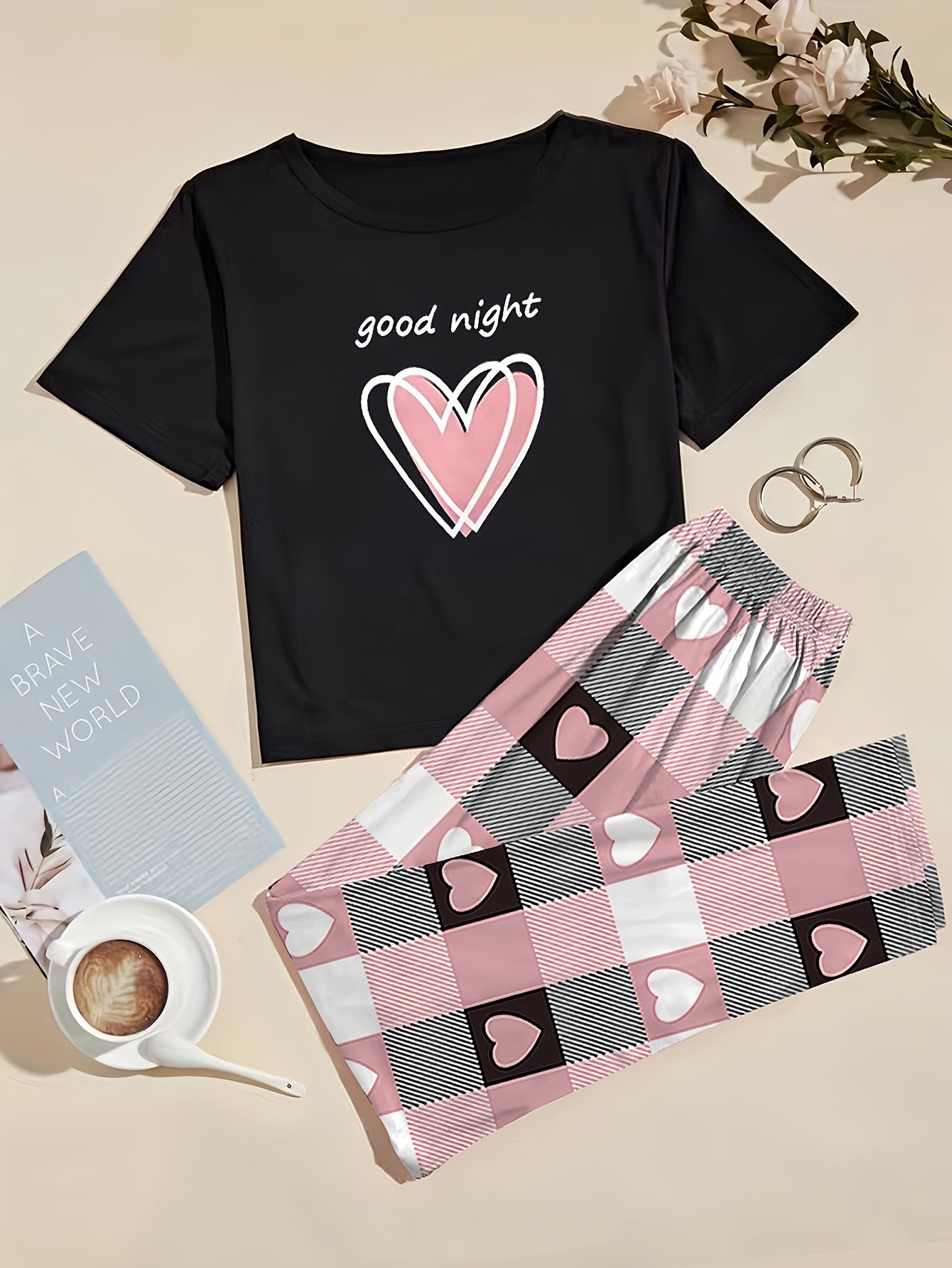 Women's heart graphic t-shirt and plaid pants set in casual polyester knit, featuring a short sleeve top with crew neck and elastic waist lounge pants. Perfect for lounging or sleepwear.