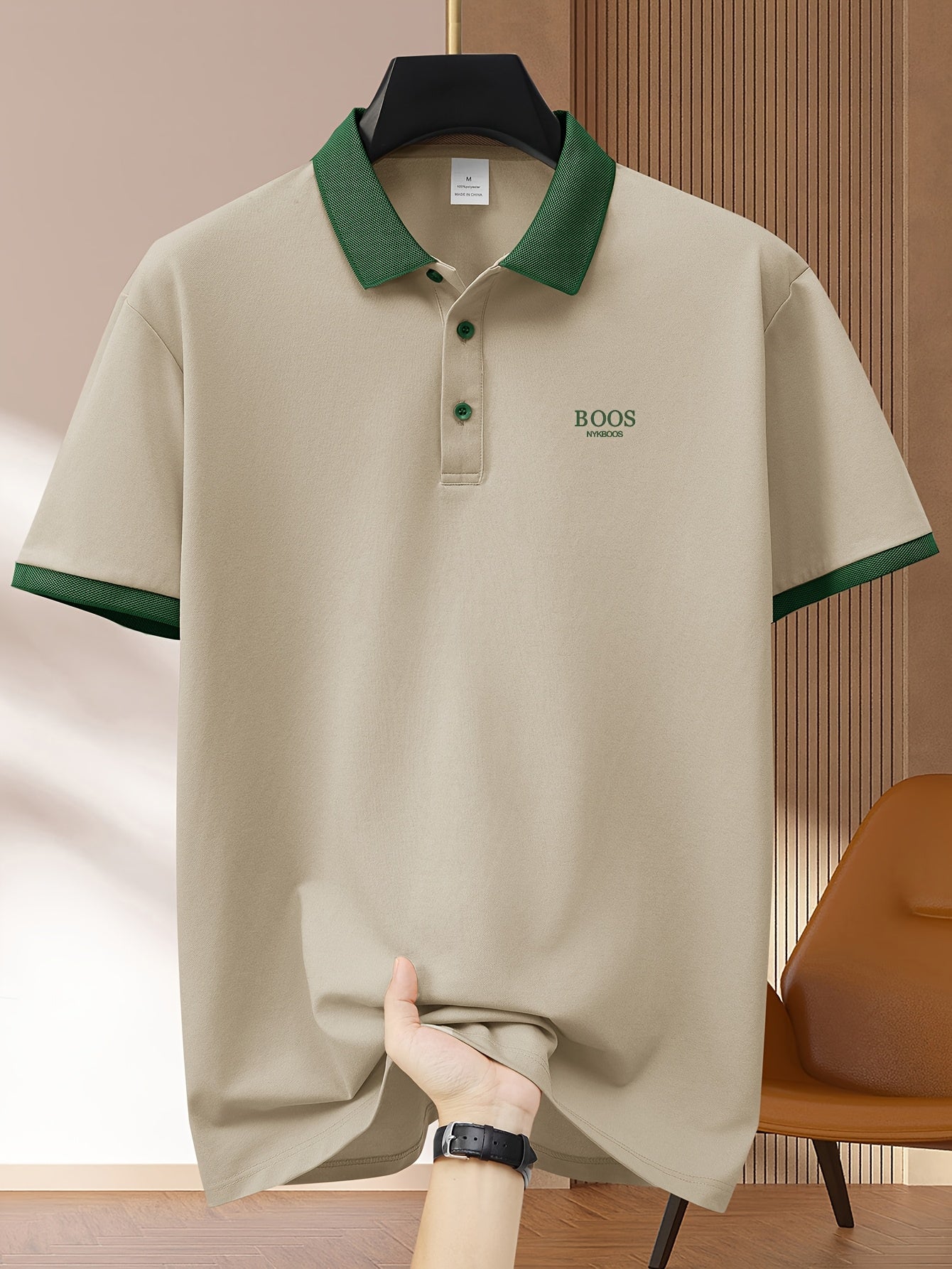 Men's light green casual polo shirt with contrast trim made of comfortable polyester. Features short sleeves, button-up collar, and a fun graphic design. Ideal for summer golf and sports