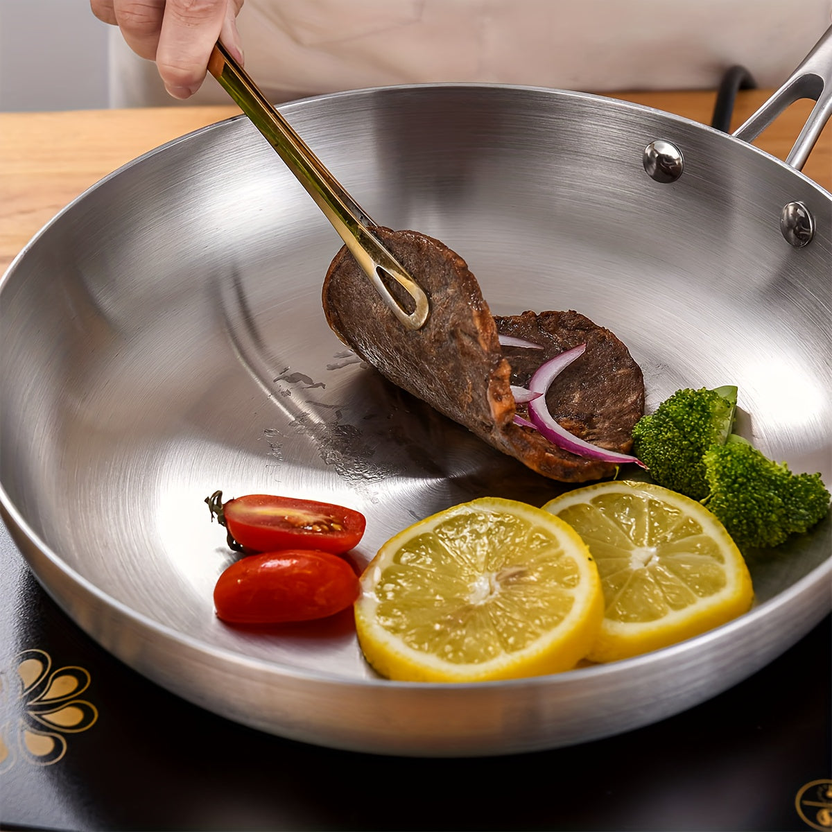 This Stainless Steel Skillet is versatile, non-stick, easy to clean, and has a durable and comfortable grip handle for effortless cooking. It is perfect for sautéing, frying, and baking, and is dishwasher safe, making it ideal for both home and