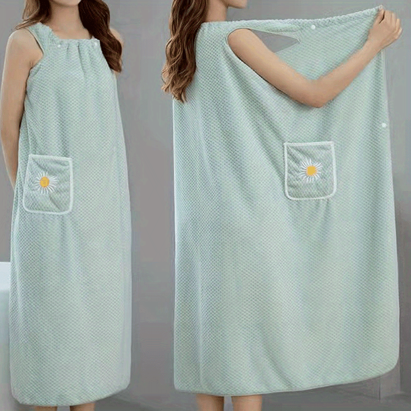 Extra-long light blue coral fleece bath towel with daisy pocket. Highly absorbent, machine washable, soft, and durable. Perfect for bathroom or robe wear.