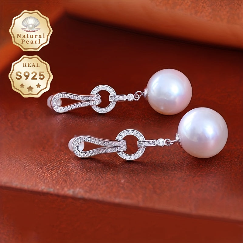 Add a touch of elegance to your collection with these must-have Pearl Dangling Earrings. Crafted with 13-14mm round natural freshwater pearls, these fashionable long earrings are made of S925 silver. Each pair is unique and features varying shapes and