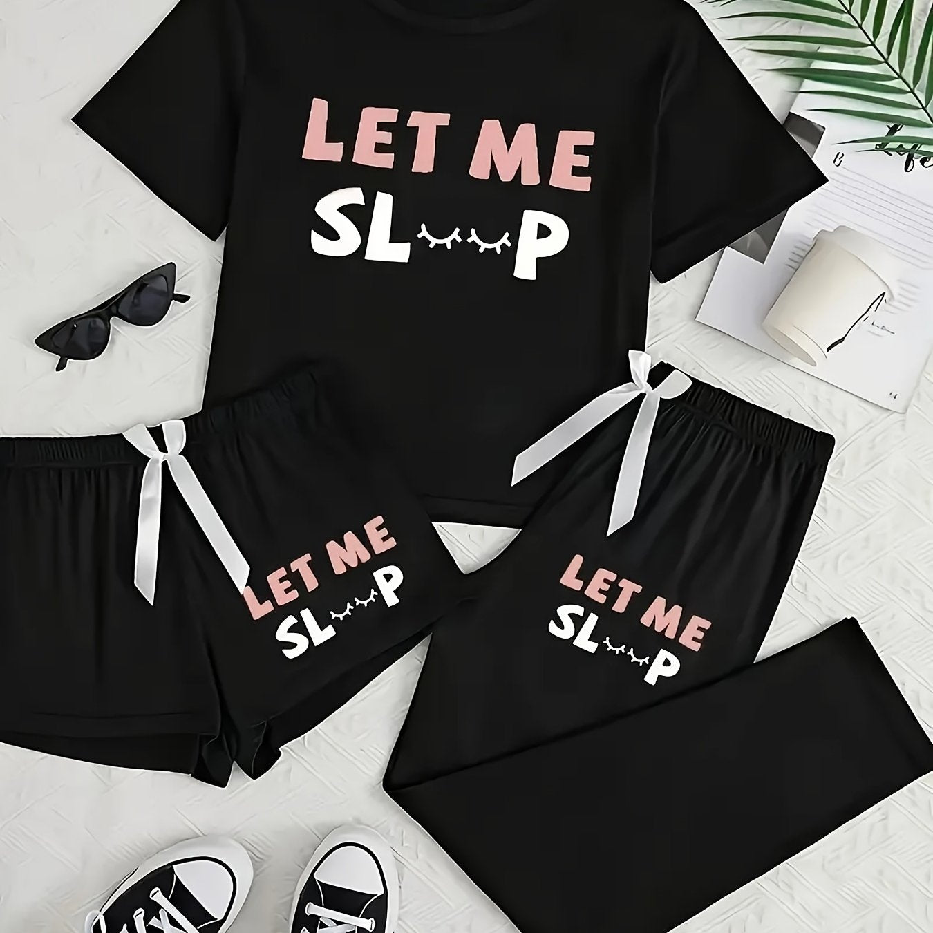 Casual pajama set with letter print, short sleeve top, long pants, and shorts.