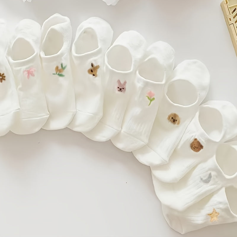 10 pairs of adorable white ankle socks with embroidered patterns, perfect for everyday wear.