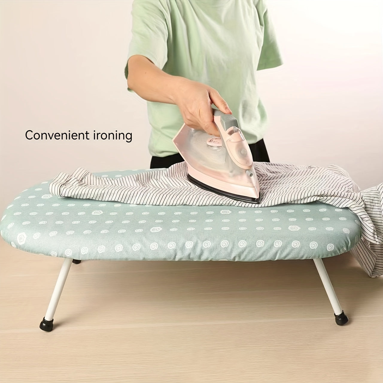 Compact Folding Ironing Board - Made of Stainless Steel and Plastic, Saves Space for Effortless Ironing and Neat Storage, Comes in White with Cloth Cover.