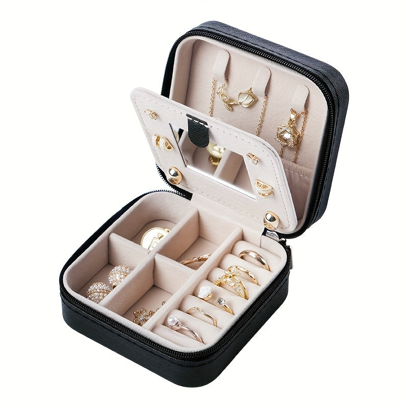 Compact and stylish portable jewelry box with mirror, zipper, and flip cover. Ideal for storing rings, earrings, and necklaces on-the-go.