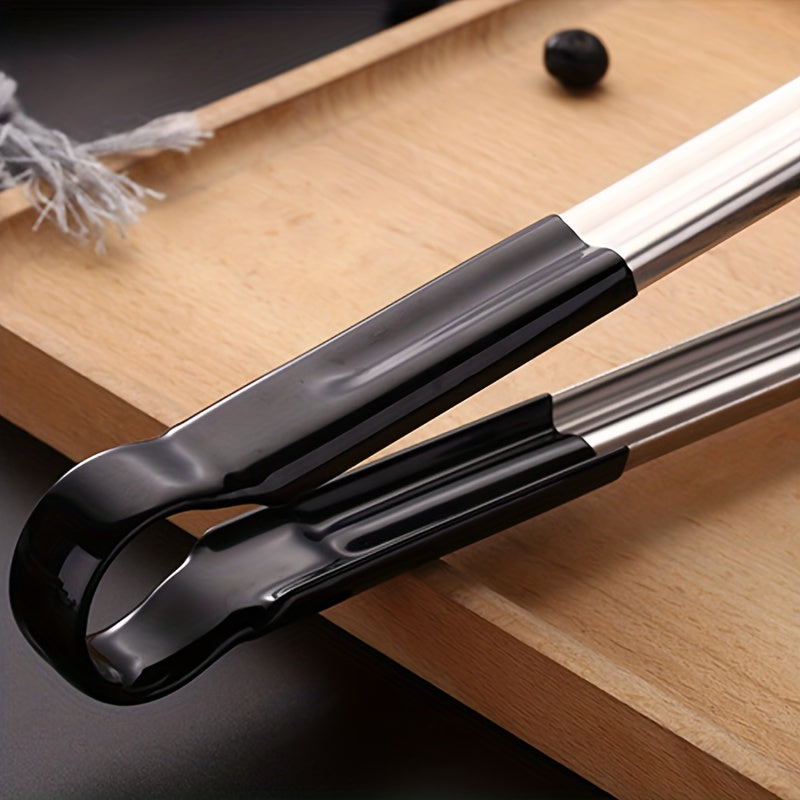 1 pc Stainless Steel Tongs for BBQ and serving. Non-slip and multi-functional. Great for grilling and buffet. Kitchen essential.