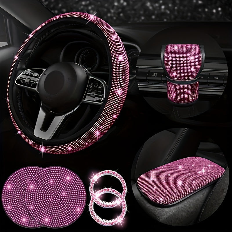 7-piece set of bling car steering wheel covers with cup holder coaster and gear shift knob cover. Made of polyester fiber with auto diamond detailing. Includes armrest pad and start button