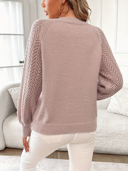 Elegant pink V-neck sweater with hollow out detail, ribbed cuffs & hem, made of 100% polyester, perfect for fall/winter comfort.