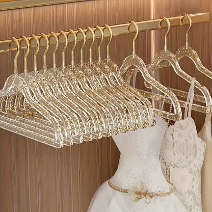 A set of 12 premium acrylic hangers with a non-slip, sparkling transparent design, providing a firm grip for wardrobe storage. These durable, thick hangers are perfect for bedroom closets, offering a traceless hanging solution.