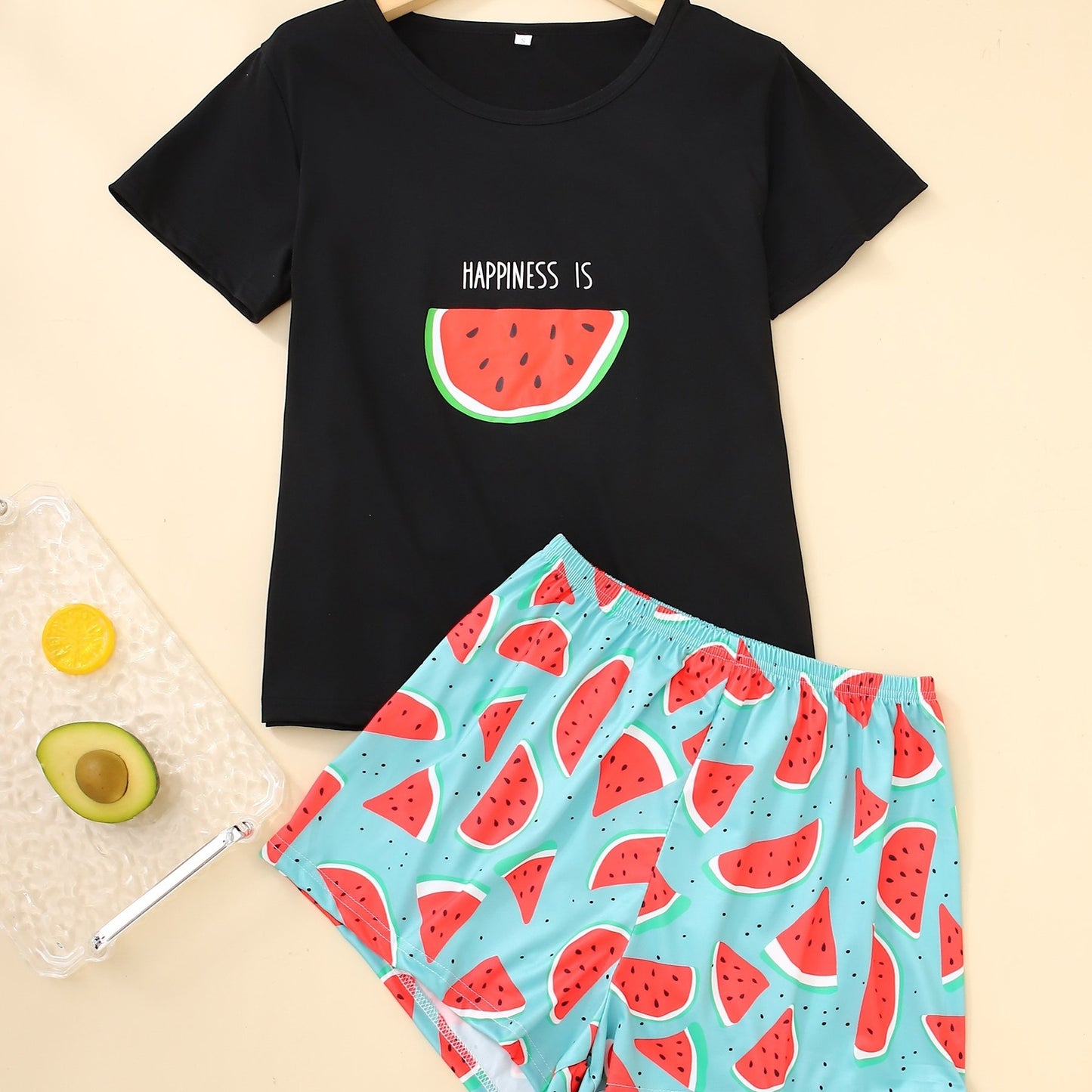 Women's loungewear set with watermelon and letter print, including short sleeve top and elastic shorts.