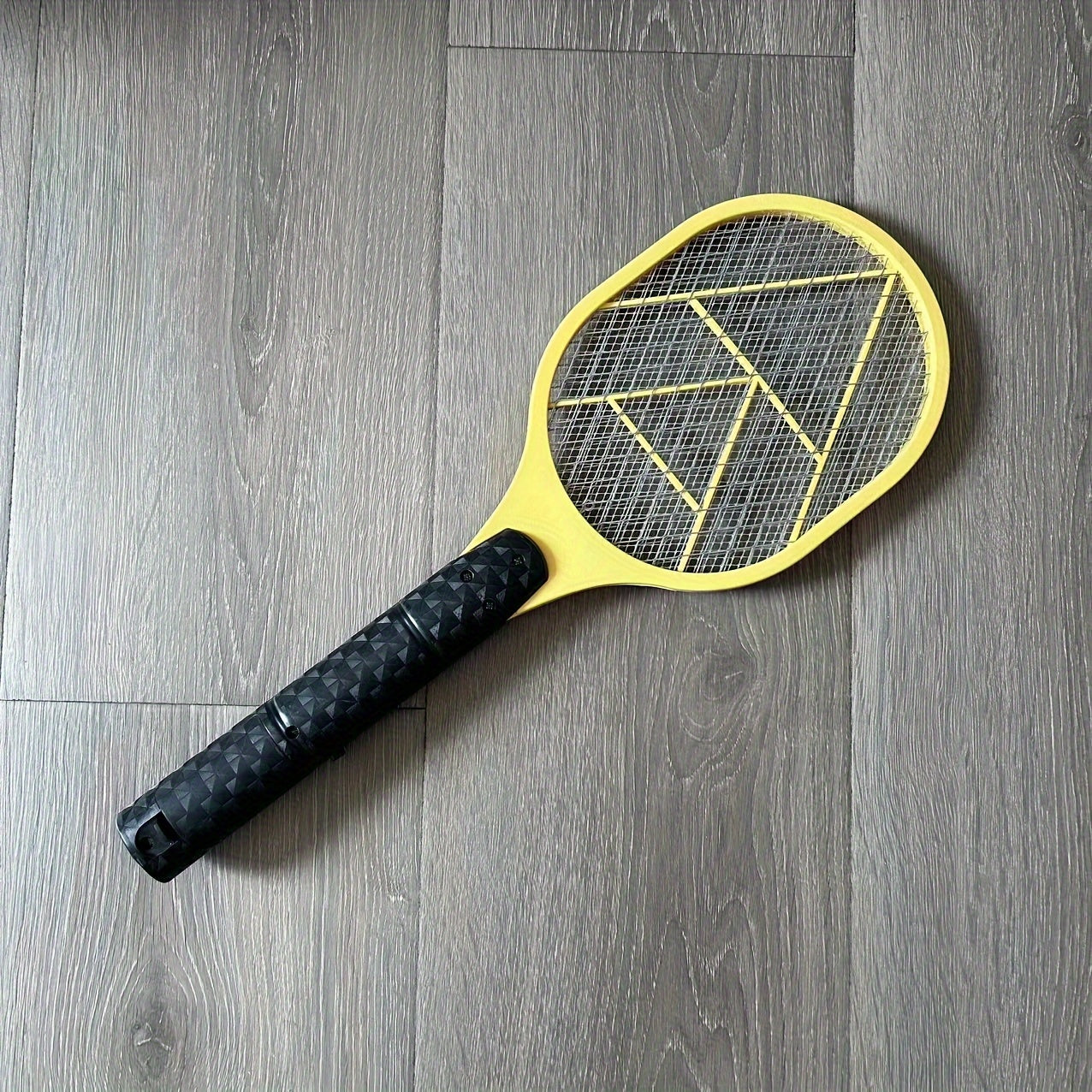 Electric fly and mosquito swatter that operates on batteries (AA batteries not included), made of durable plastic/aluminum/tin.