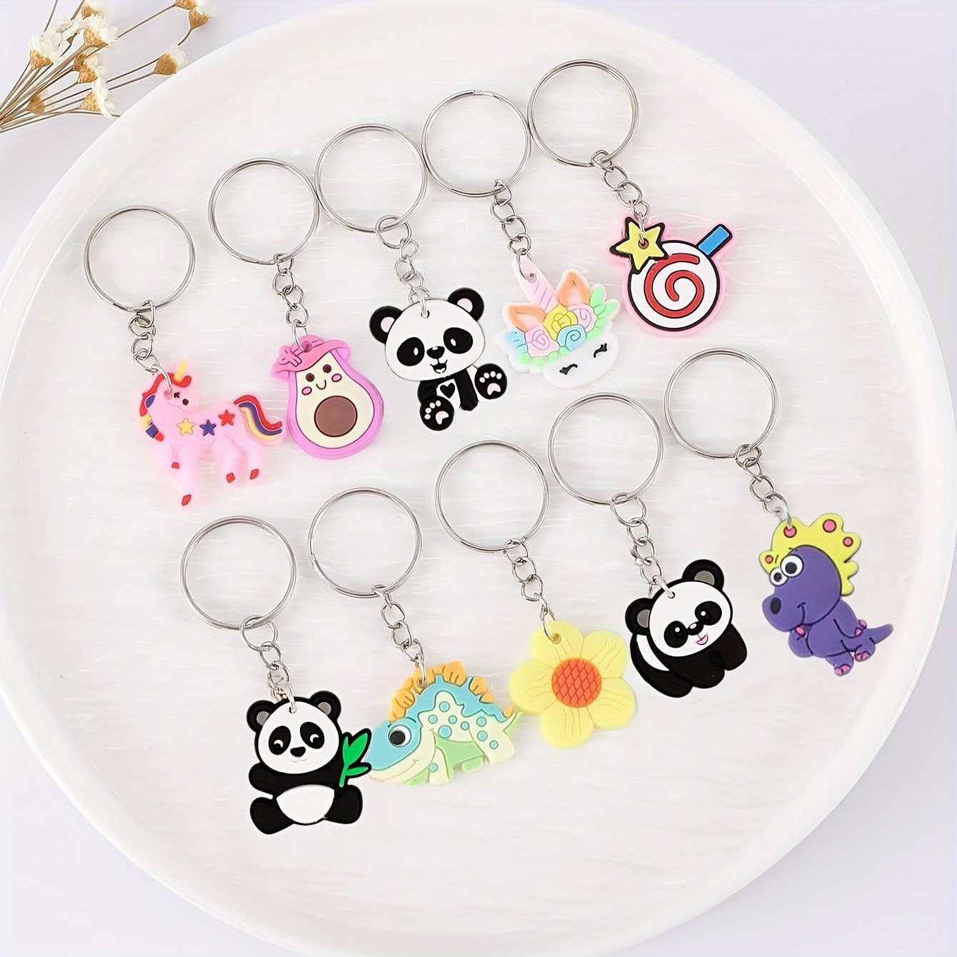 Set of 100 adorable cartoon keychains featuring panda, rainbow, and avocado charms - ideal for adding a touch of cuteness to your bags and keys. The perfect gift for women.