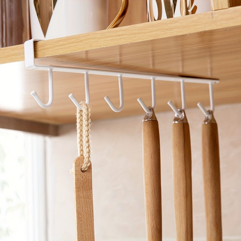 Keep your kitchen cups, mugs, and utensils organized with this durable iron under cabinet hanging storage organizer. Includes 6 detachable hooks for easy access. Perfect for saving space in your home or office.