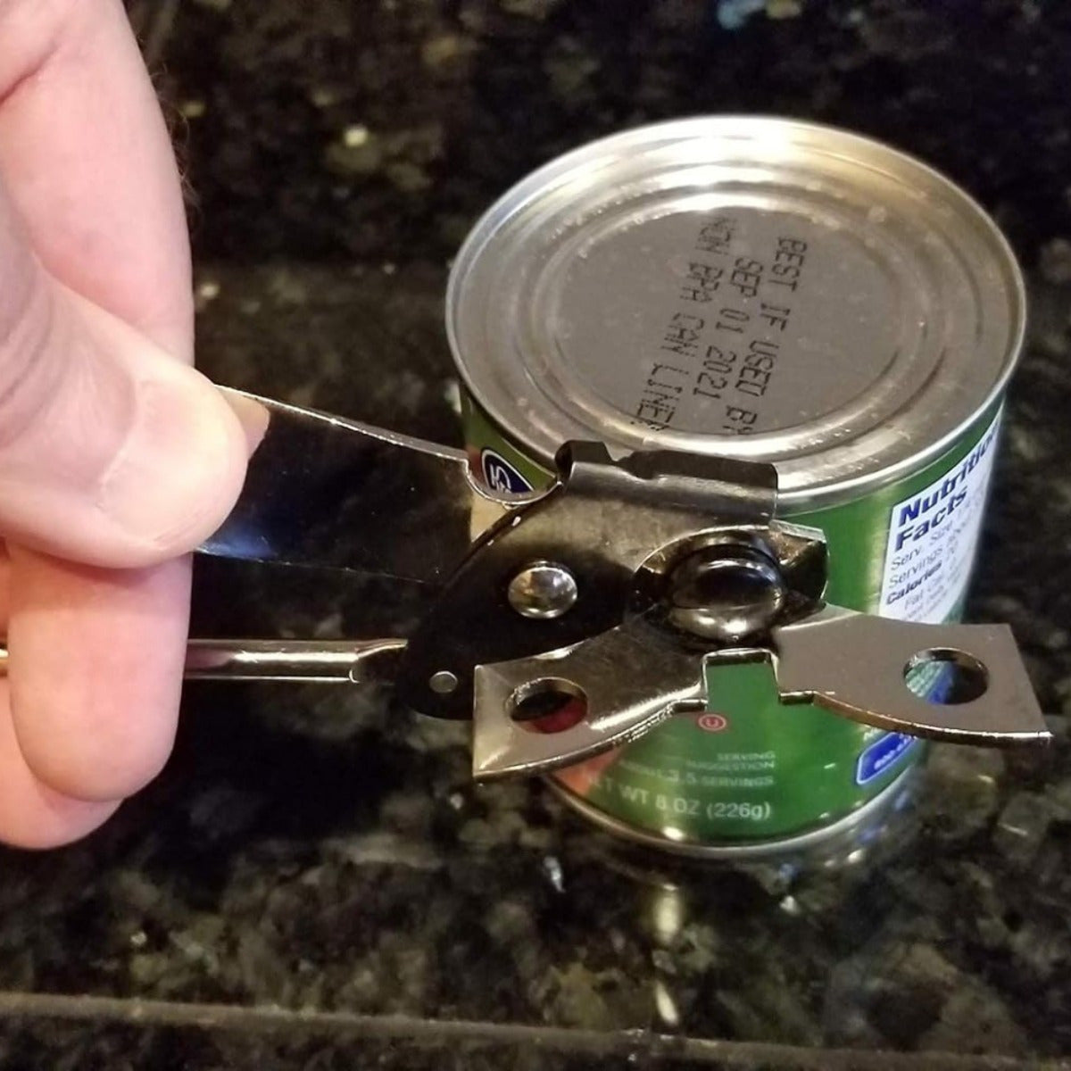 Durable Metal Can Opener with multiple functions, including cutting tin cans and opening beer bottles. Perfect for use at home, camping, picnics, and during travel.