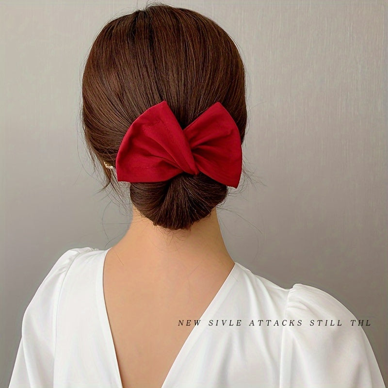 Bow shaped ponytail holder for creating lazy hair curls and buns, a fashionable women's hair accessory.