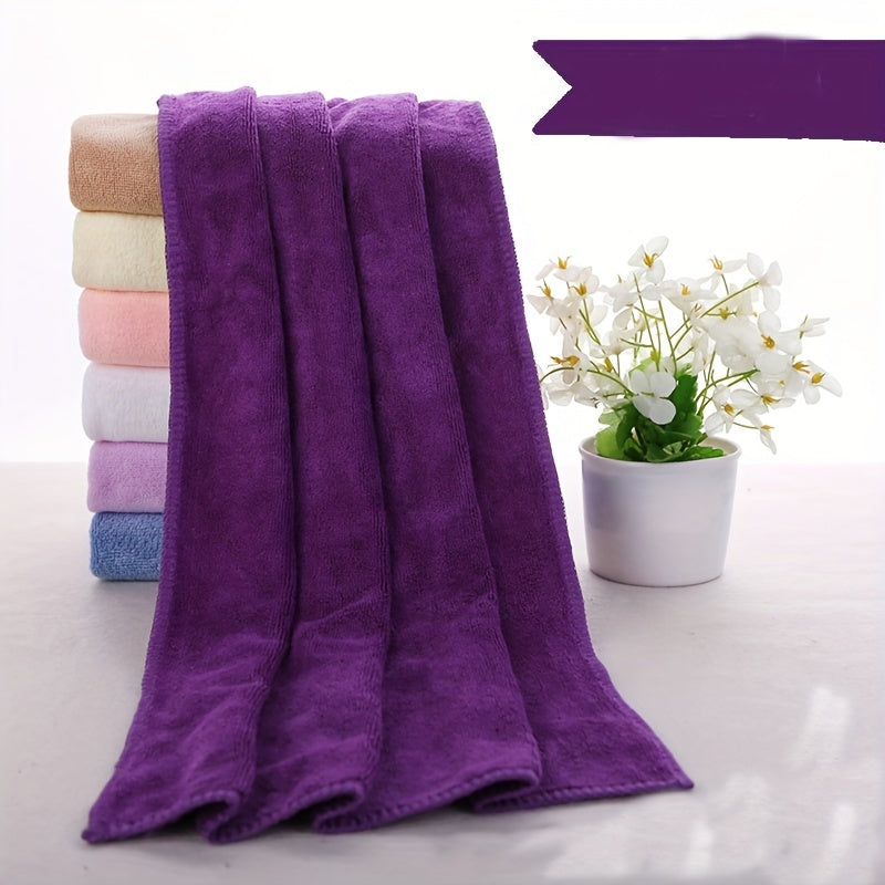 Soft microfiber bath towel with quick dry and absorbent features for use at home or in the spa, featuring a modern cloud pattern design.