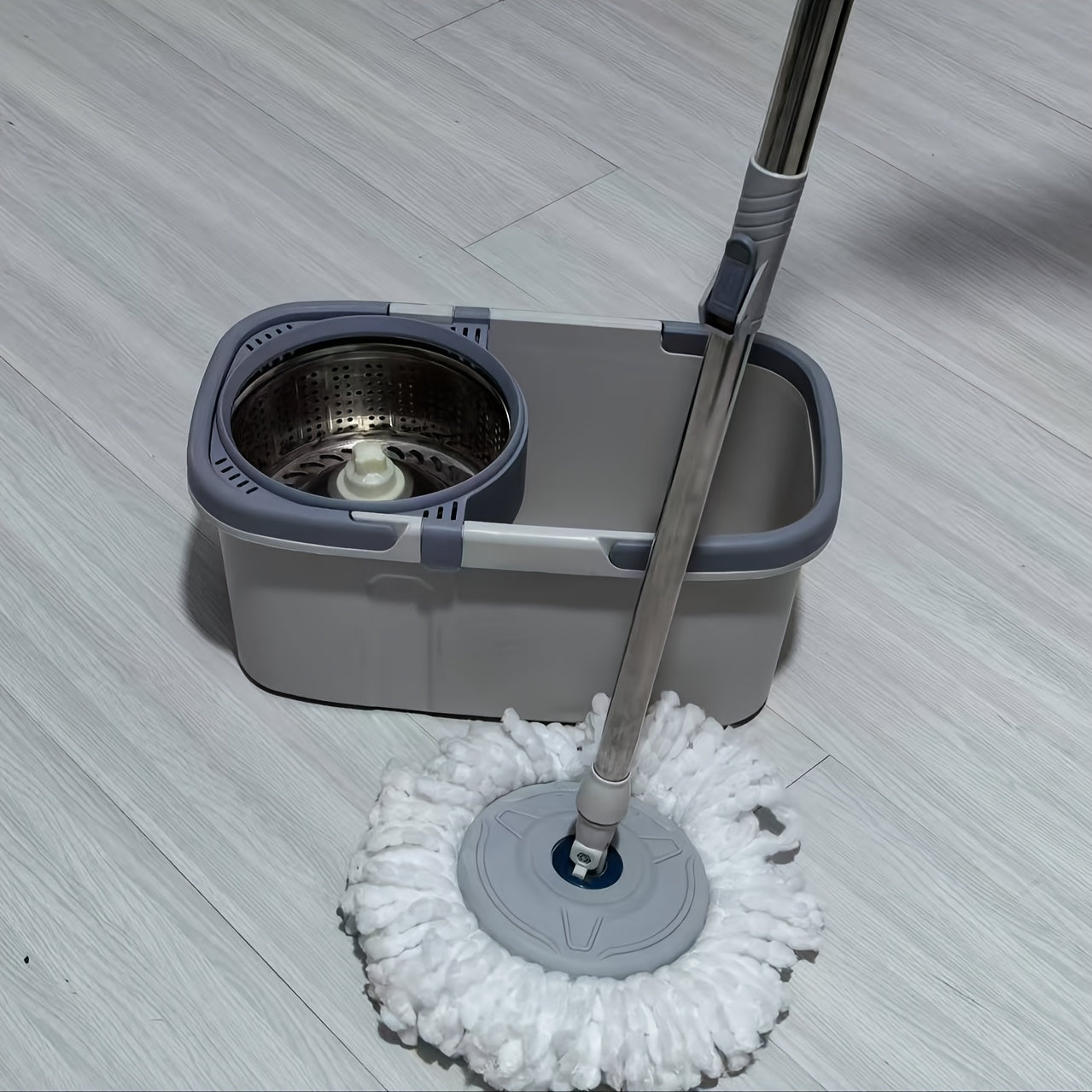 The Stainless Steel 360-Degree Rotating Mop Bucket Set features dual carry handles, a detachable washboard, and a protective cover for easy dumping. Perfect for home use, this set is ideal for cleaning in the living room, bedroom, bathroom, kitchen, and