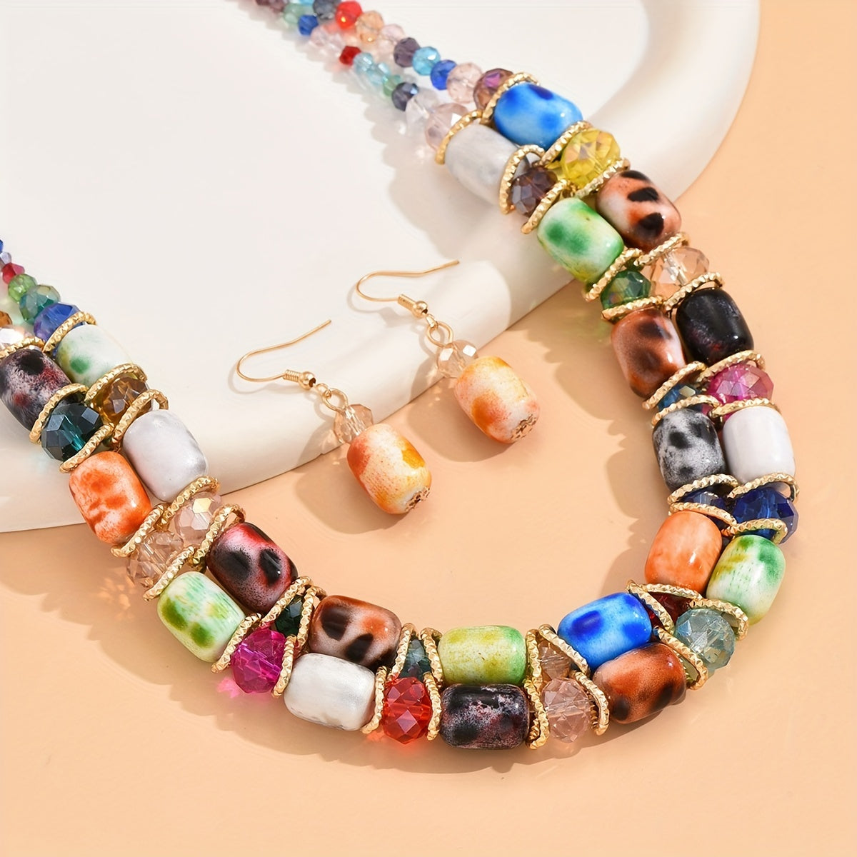 Complete your look with this Bohemian-style women's jewelry set featuring a 2-strand beaded necklace and earrings, suitable for everyday wear or special events.