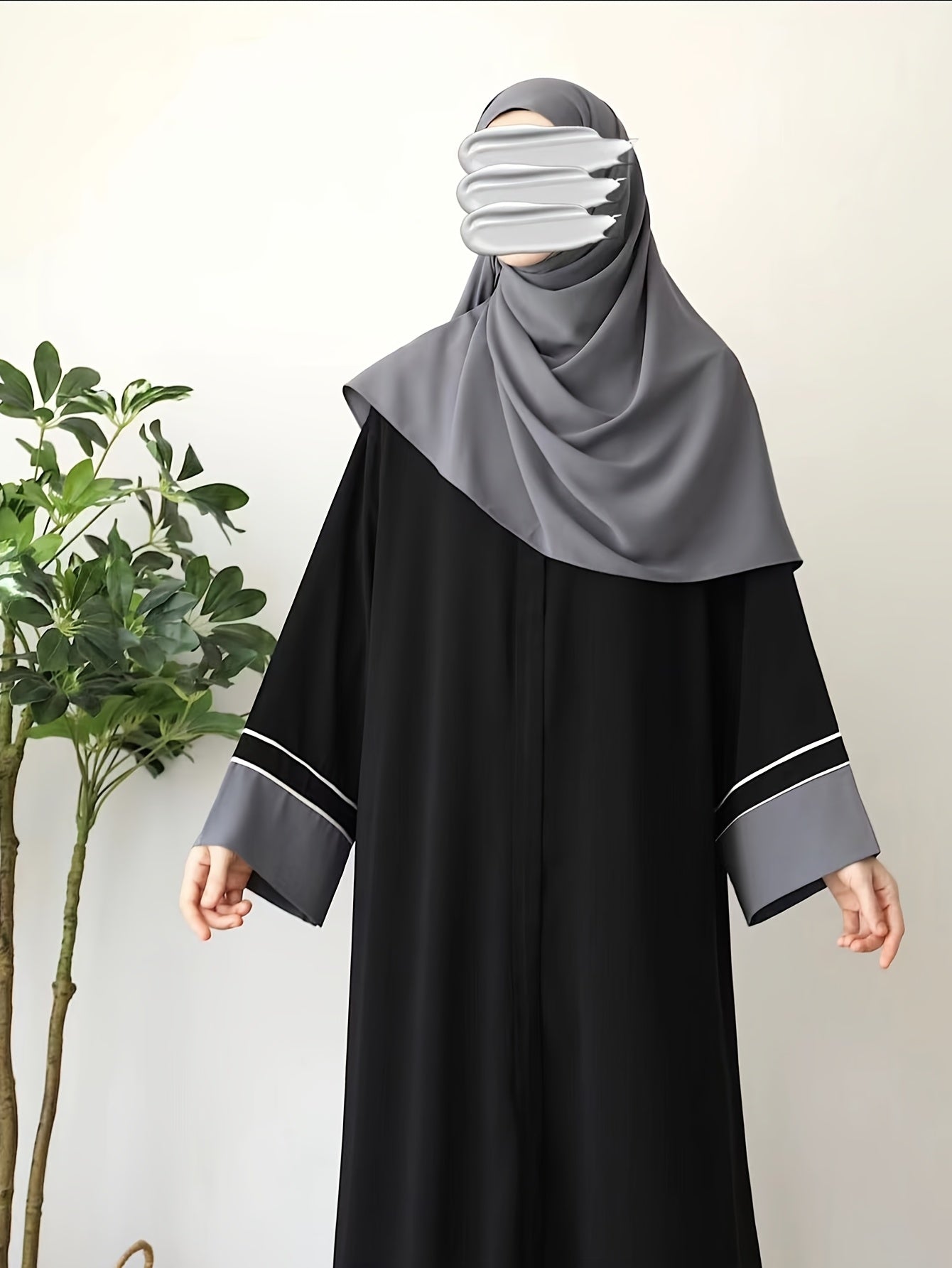 Elegant Black Abaya robe for Middle Eastern Muslim women with long sleeves and loose fit.