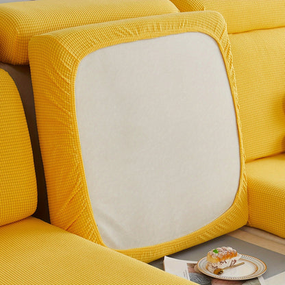 Durable sofa cover protects furniture from spills and stains.