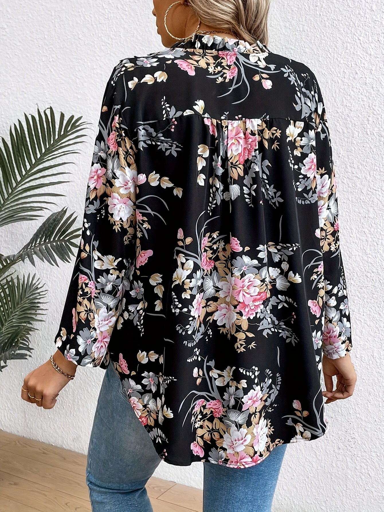 Elegant plus-size women's floral print blouse with ruffle sleeves in stylish black, perfect for casual to semi-formal occasions.