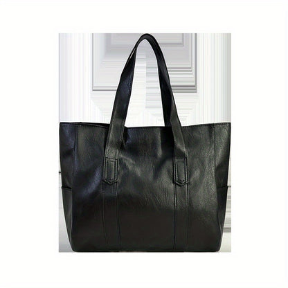 Chic black tote bag for women with foldable design, zip closure, multiple compartments, and polyester lining.