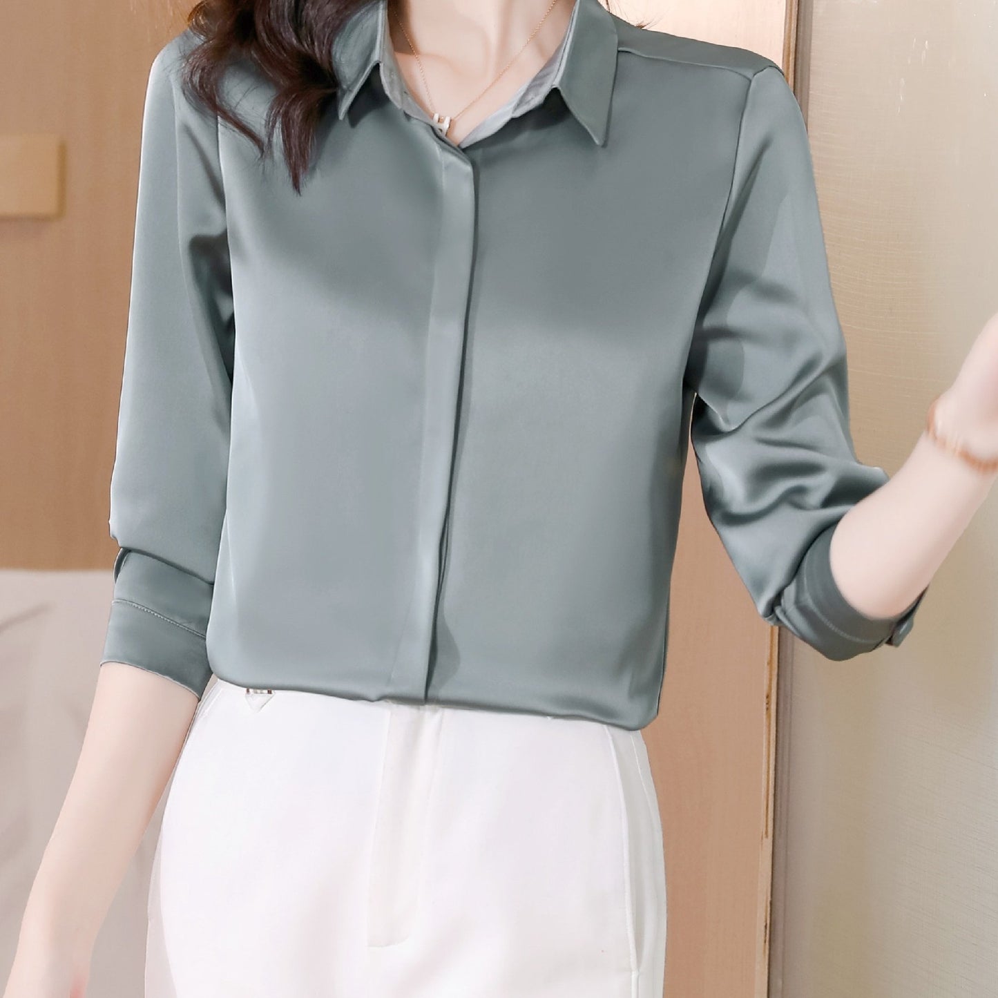 Long sleeve satin shirt with solid color, collared button-up design for women. Machine washable and perfect for spring/fall. Ideal for sophisticated adults with luxurious style.