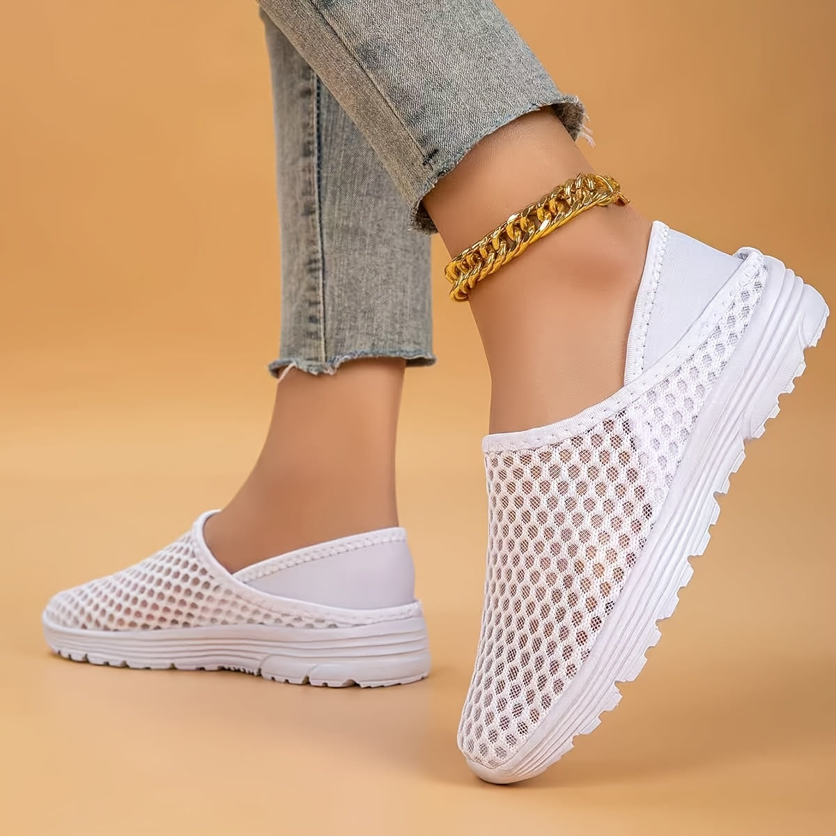 Mesh slip-on walking shoes with stability support, lightweight white summer footwear.