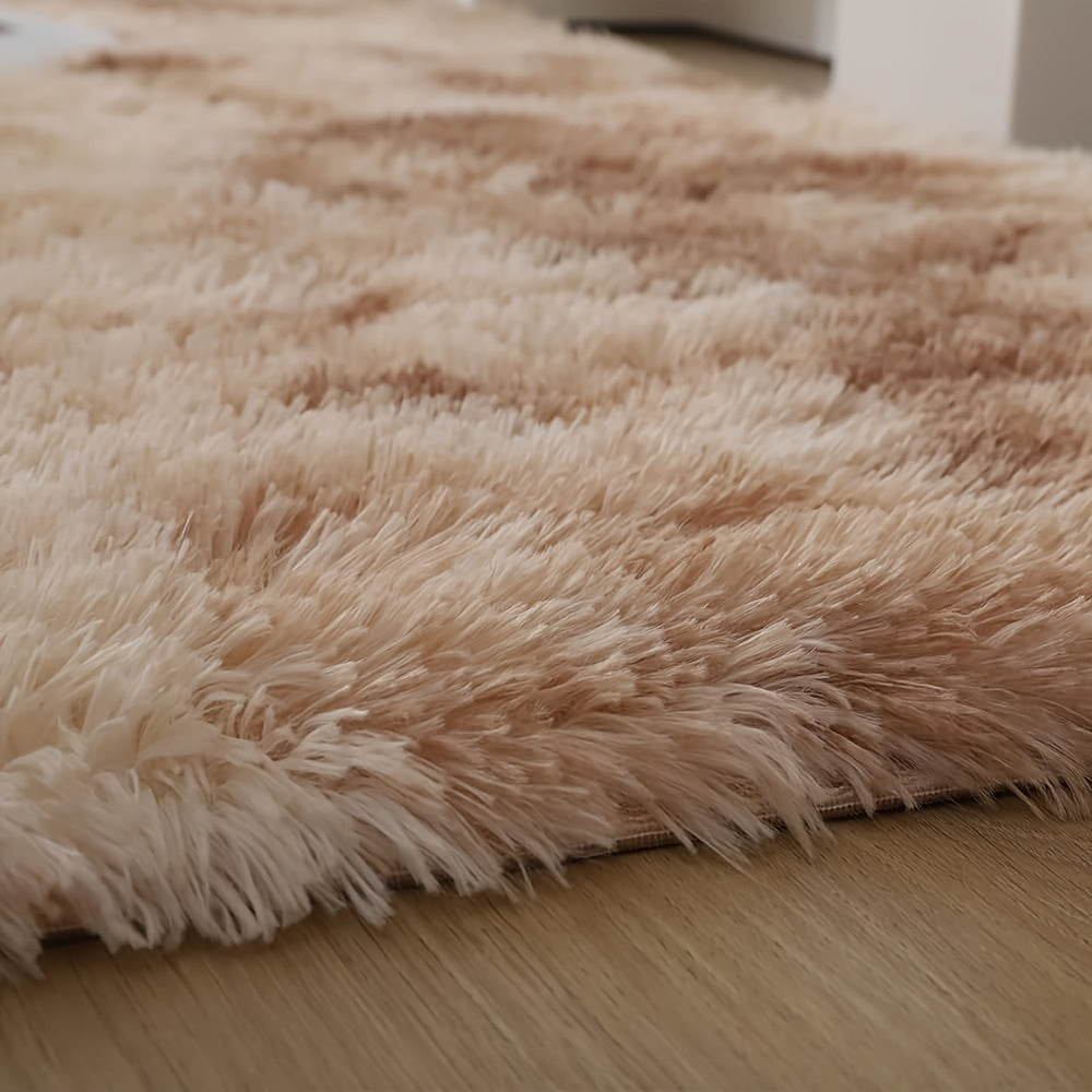 Soft shaggy area mat with a tie-dye design, made with 260g polyester and a 0.6cm thick sponge base. Features a 21 density for added comfort. Machine washable and suitable for indoor use in living rooms, bedrooms, game rooms, and dorms. This Nordic style