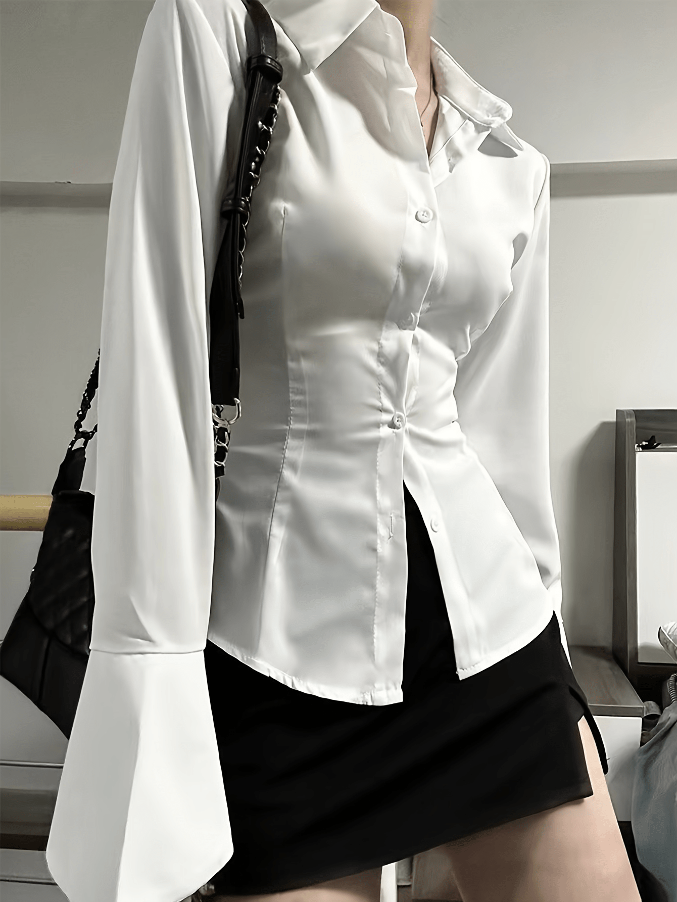 Chic solid color blouse for women with back tie detail and front buttons. Made of polyester blend, machine washable, ideal for all seasons.