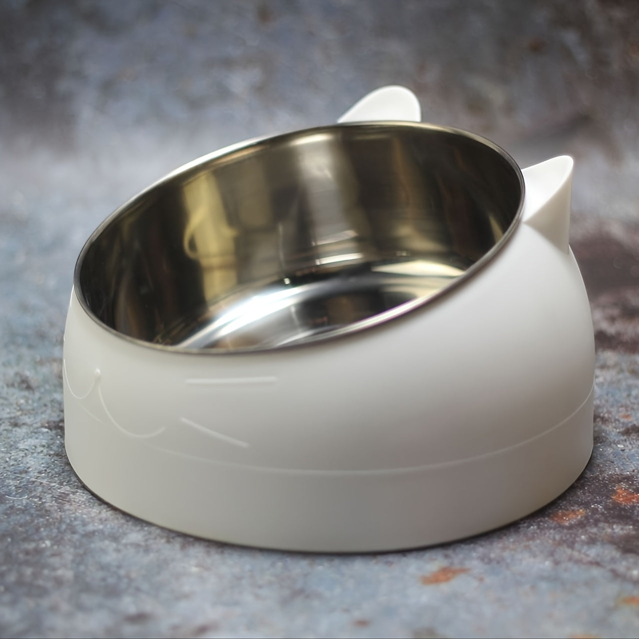 Raised stainless steel cat feeder bowl with non-slip base for neck protection, holds 100ml of food or water.