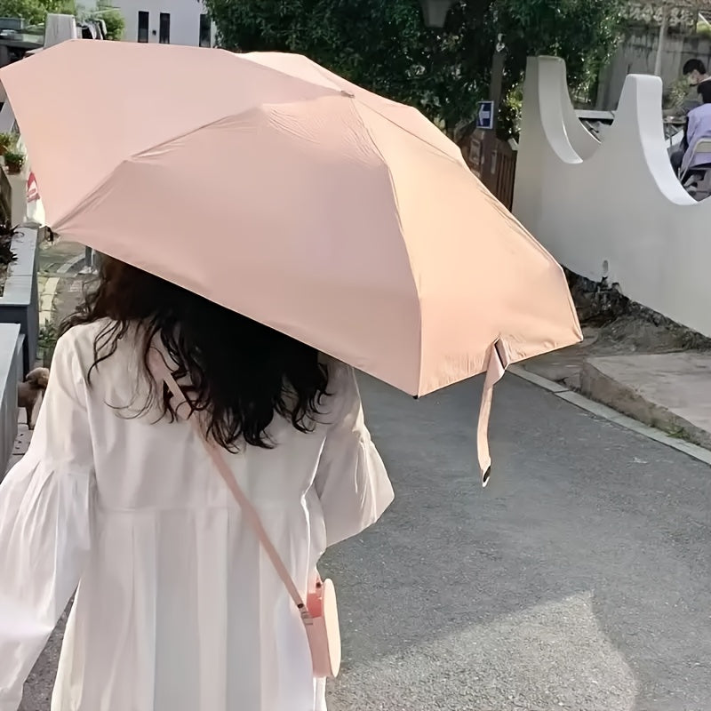 Compact 5-fold umbrella for women with sun-resistant fabric, 6-rib frame, manual open/close, and plastic handle, in a casual cute style.