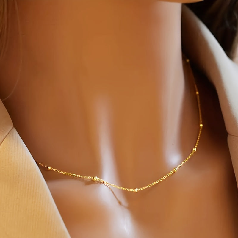 An elegant 925 silver necklace featuring 2 grams of shimmering beads, a delicate collarbone chain, and a stylish piece of jewelry designed for women.