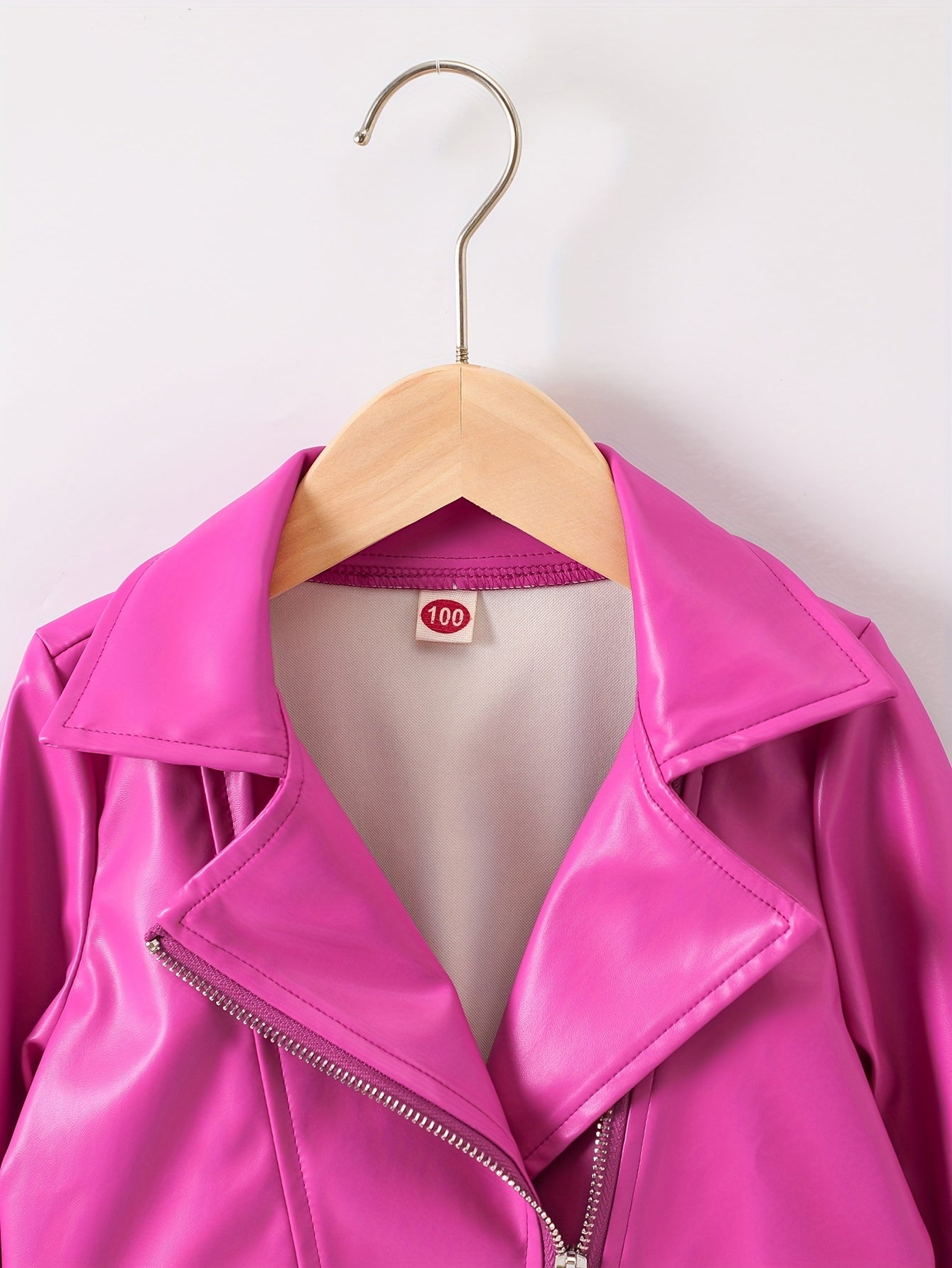 Faux leather jacket with lapel, diagonal zipper, unlined.