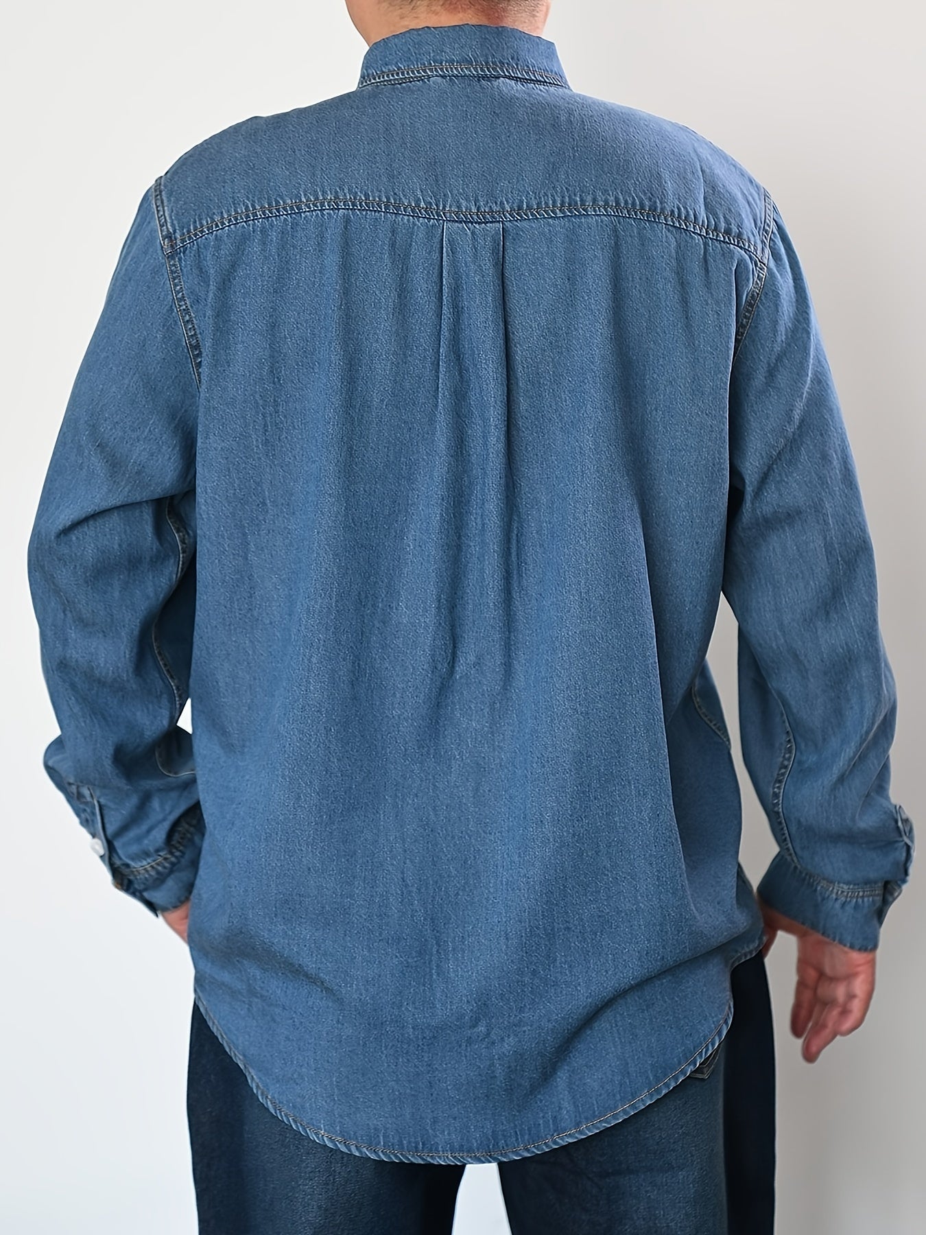 Men's plus size denim shirt, perfect for outdoor activities in spring and fall. Stylish, loose fit and breathable.