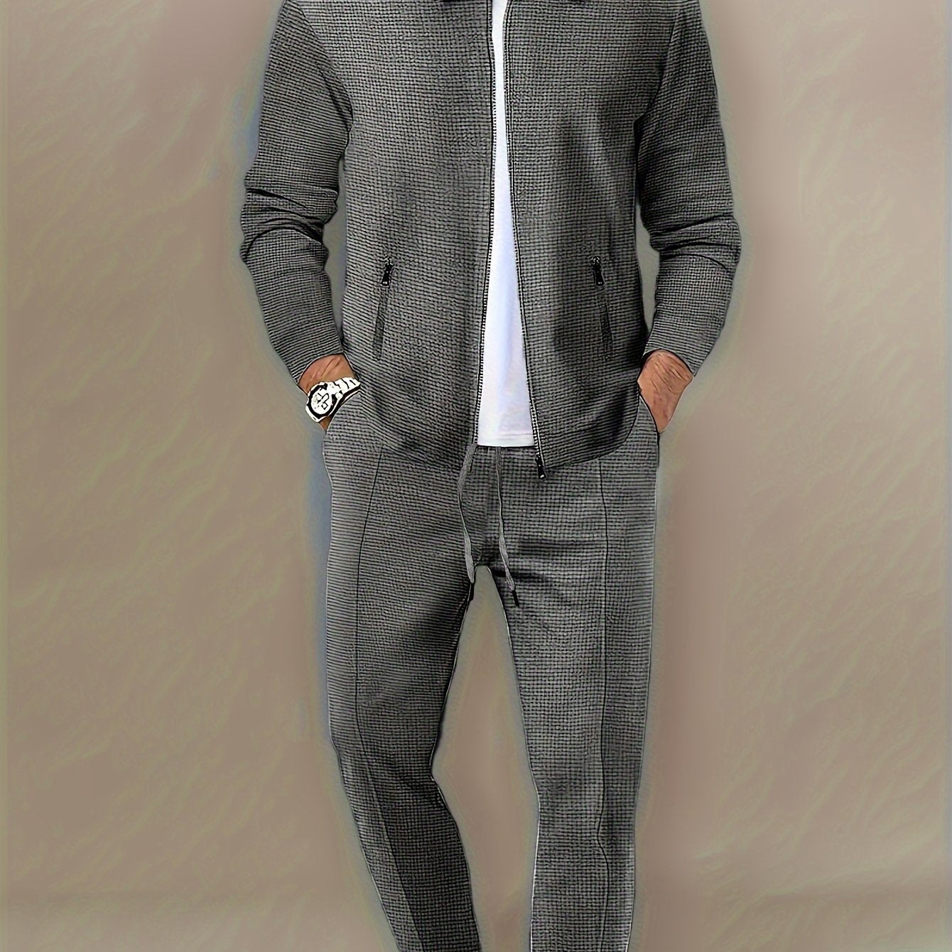 Polyester sports suit with waffle texture, casual lapel jacket and long pants set with zipper detail, solid color loose knit fabric, long sleeves, full polyester composition.