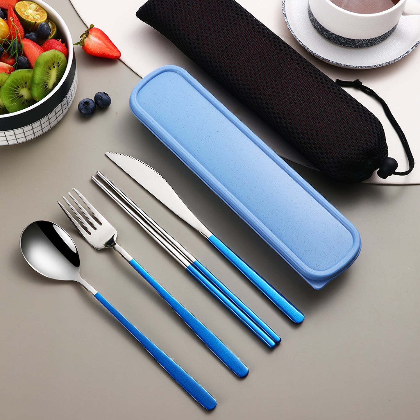 Stainless steel cutlery set includes knife, fork, spoon, and chopsticks in portable case for picnics, camping, lunches, and gatherings.