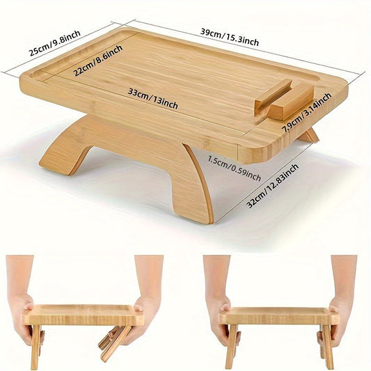 Non-slip sofa tray with phone holder and foldable armrest table, ideal for wide sofas and includes a drink holder shelf. Made of wood.