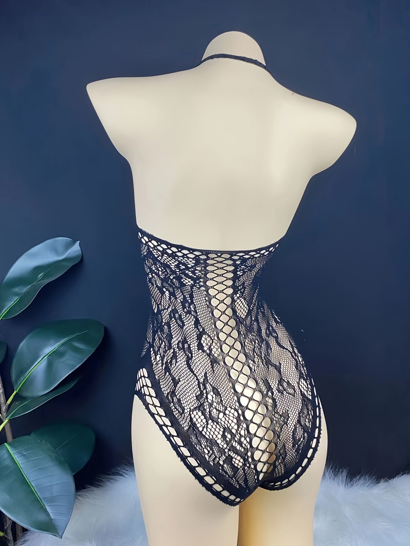 Stylish lace bodysuit for women with a hollow design and body-shaping corset top made from polyamide and knit fabric.