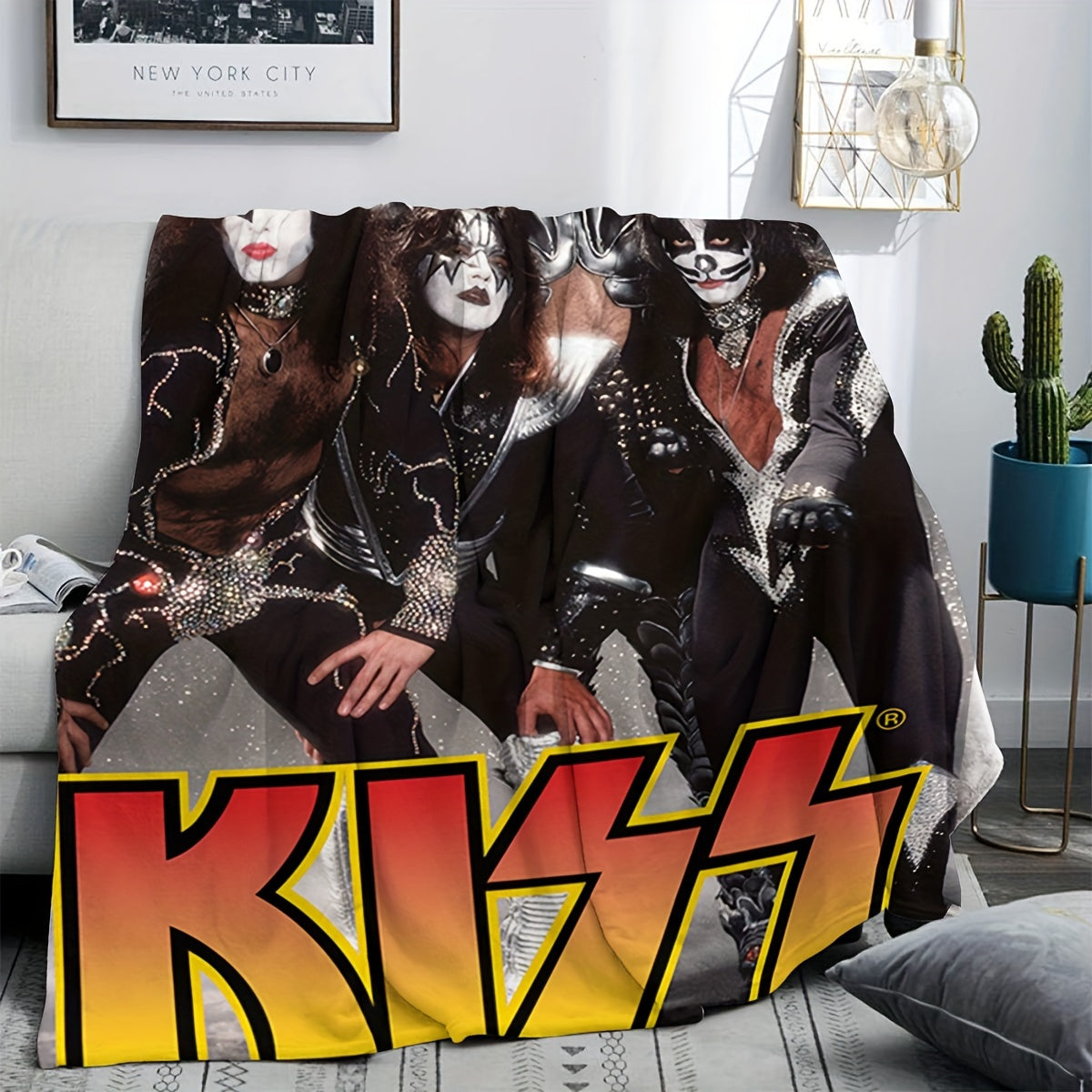 Add a touch of rock 'n' roll to your home with the KISS Rock Band-themed throw blanket. Made from knitted polyester, this lightweight blanket features a vibrant red and yellow gradient design, perfect for adding a contemporary style to your bedroom