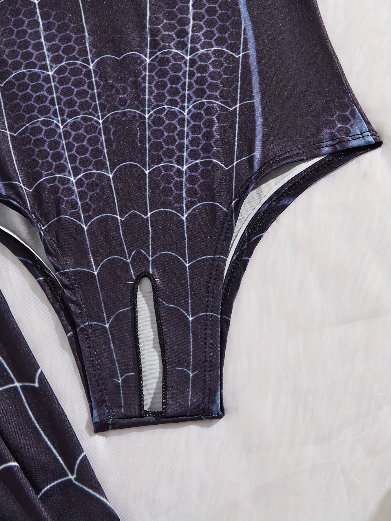 Spider-themed cosplay outfit for women includes turtleneck bodysuit, stockings, and lingerie.