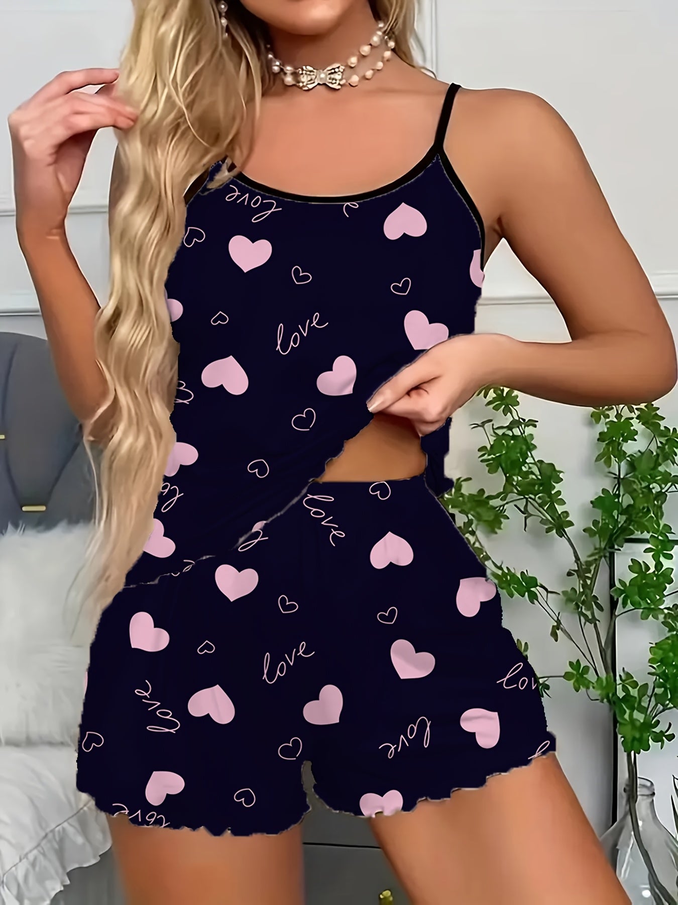 Women's sexy polyester pajama set with love heart print spaghetti strap shorts, perfect for all seasons.