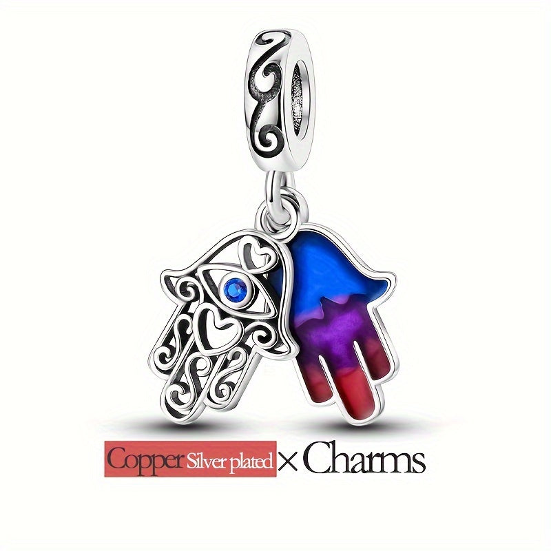 Silvery-plated copper hand of Fatima pendant charm with hypoallergenic qualities and a colorful glaze. Designed to fit original brand bracelets, this charm is perfect for women's jewelry making and adding to DIY charms projects.