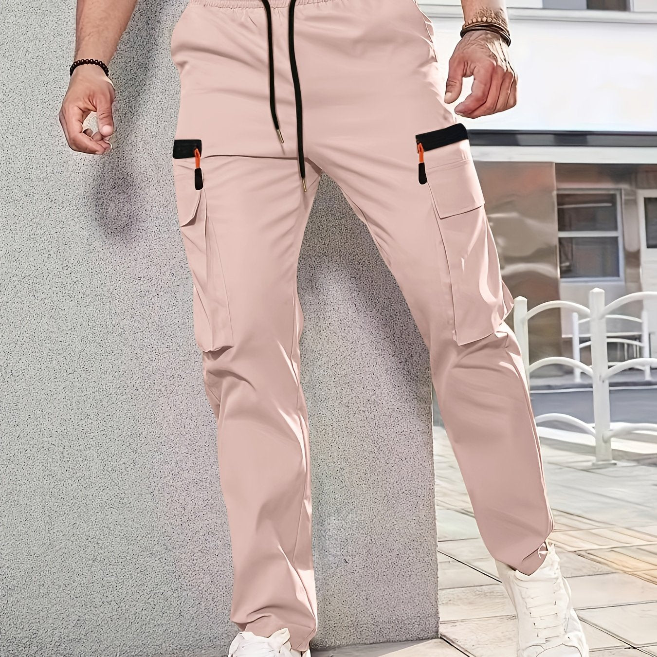 Men's casual cargo pants made of solid color polyester, feature a regular fit, multiple pockets, and straight-leg design for sports and leisure activities all year round.