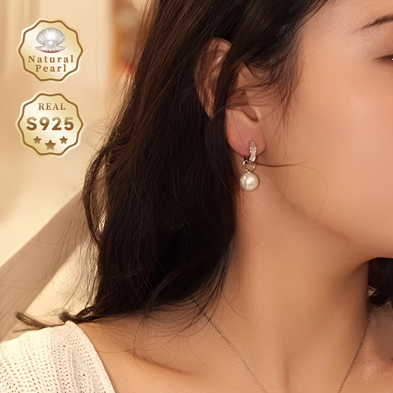 A Pair of Pearl Earrings in a Gift Box - A Must-Have Gift for Women. These fashionable hoop earrings are made of S925 Silver with 10-11mm round natural freshwater pearls. The pearls are removable and add a graceful touch to any outfit. Please note that