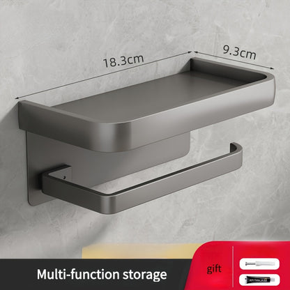 Toilet roll holder with shelf for bathroom storage and organization.