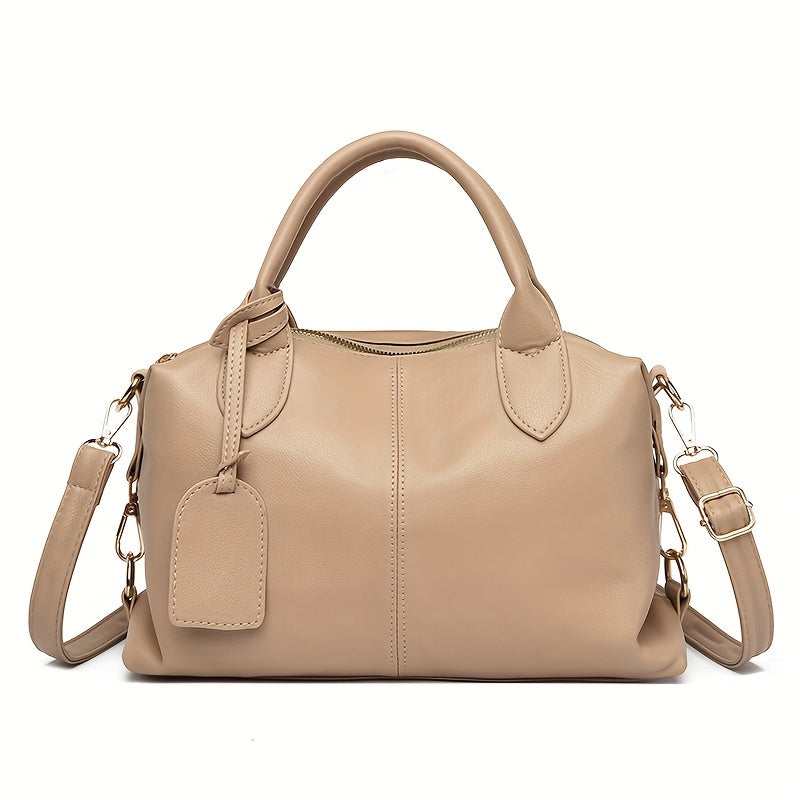 Stylish shoulder bag with removable strap and zip closure, perfect for everyday use.