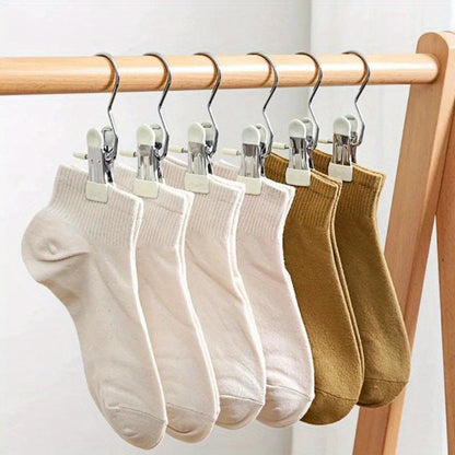 A set of 10 durable stainless steel clothespins with hooks, perfect for securely hanging laundry. These portable clothes clips are ideal for organizing your wardrobe and finishing racks. Essential household goods for keeping your clothes neat and tidy.