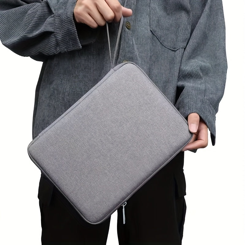 Polyester bag for tablets and laptops, with pocket, in grey color, for 26.67-33.02 cm tablets and 27.94-32.77 cm laptops.