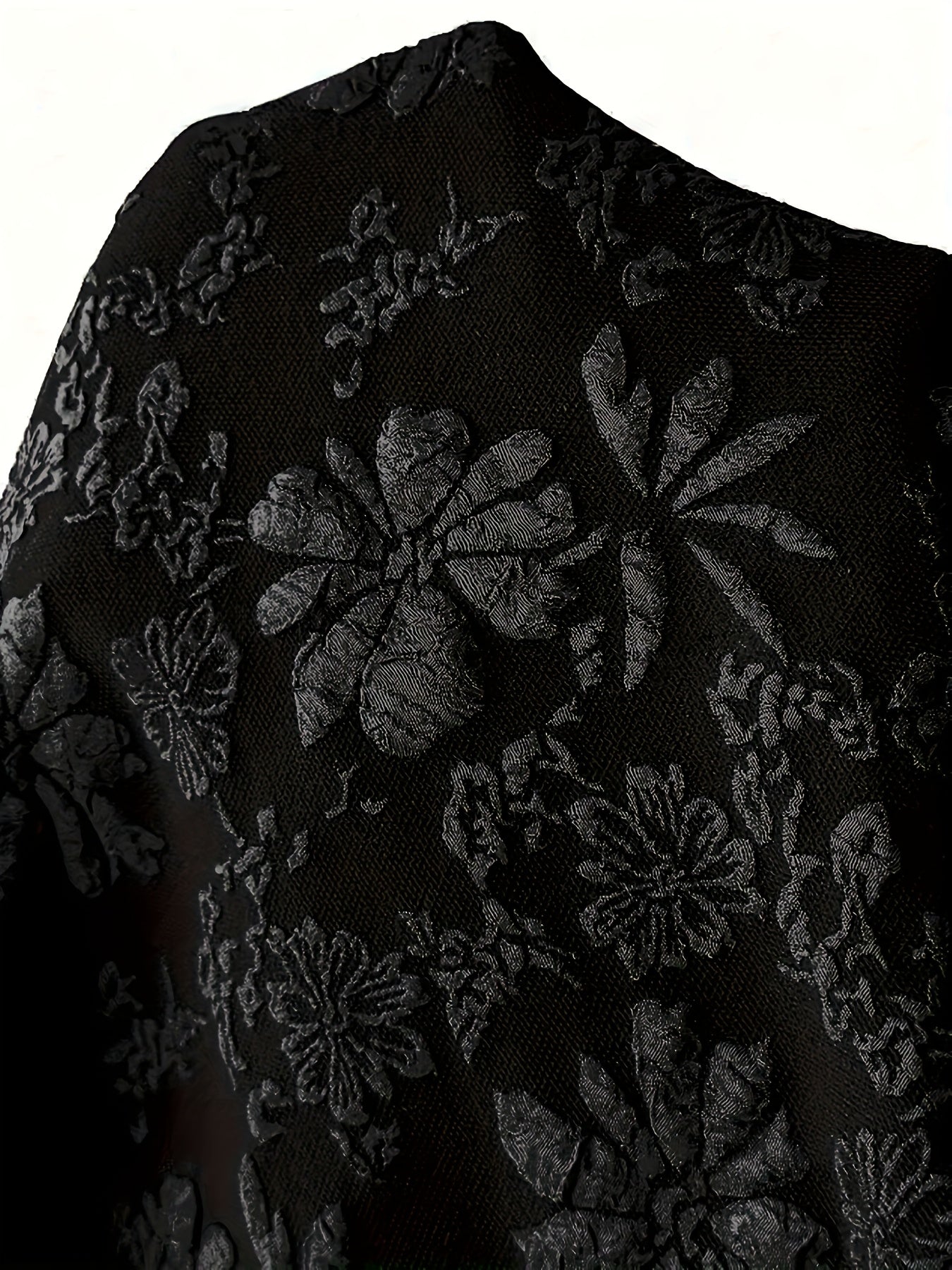 Stylish black floral jacquard hoodie jacket for plus-size women with drawstring and pockets.